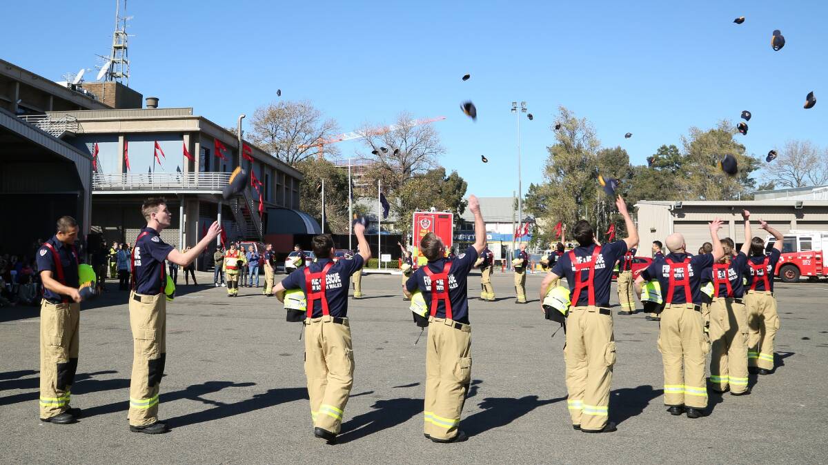 Celebration: Fire and Rescue NSW recruits celebrate their graduation. Picture: Supplied