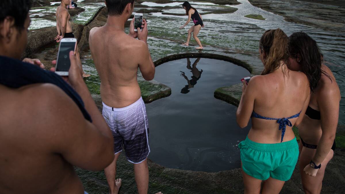 Picture perfect: Tourists post for photos at the Figure Eight pools. Picture: Wolter Peeters.