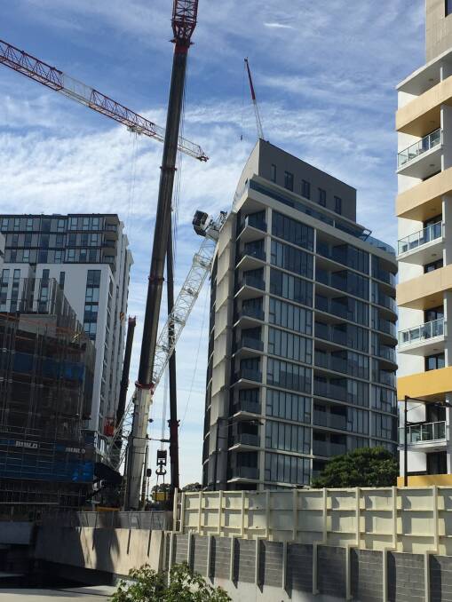 Slow going: Four mobile cranes have been brought into to remove a collapsed crane at Wolli Creek.