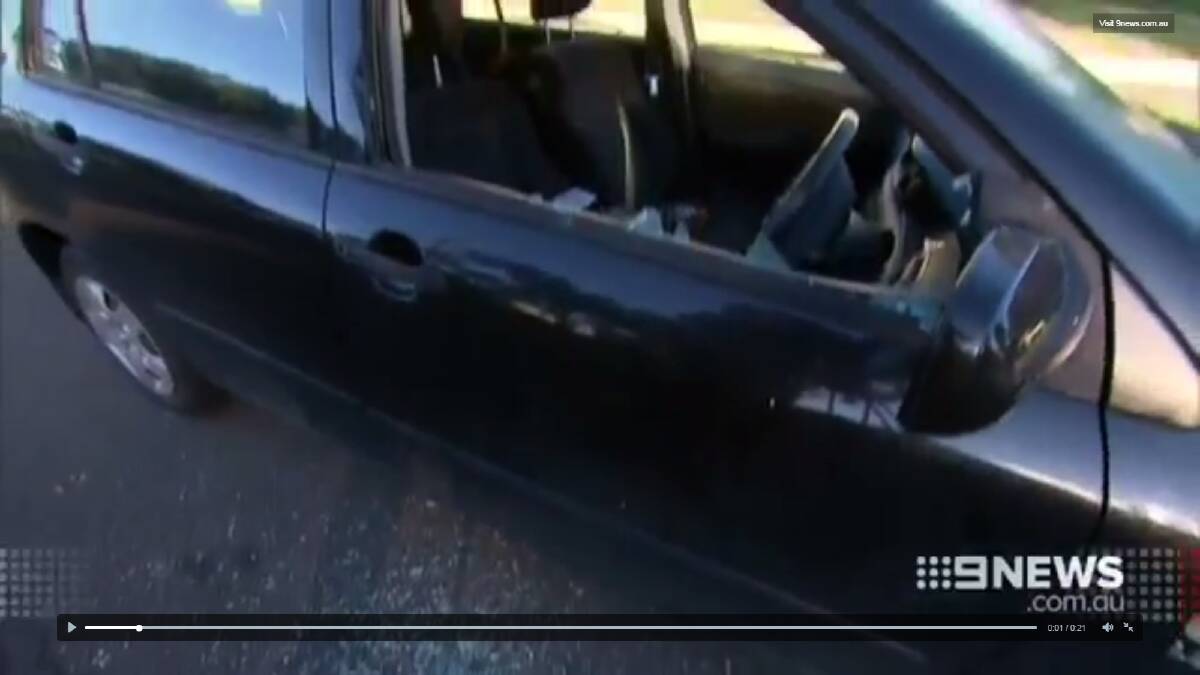 Damage: A car window was smashed in with a star picket. Picture: Nine News