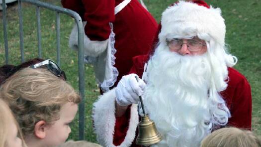 Festive spirit: Santa greets children at the Magic of Christmas event in 2013. Picture: Andrew Czech