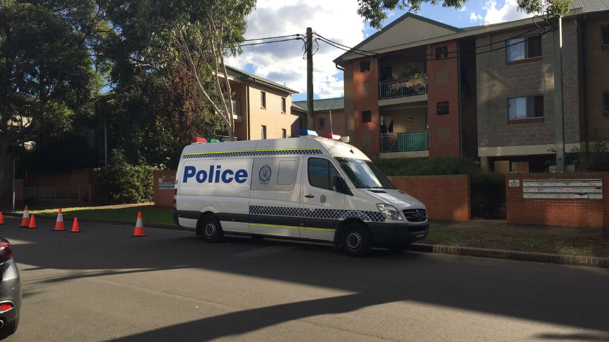 Investigation: Police remain at the scene of a murder on Roberston Street in Sutherland.
