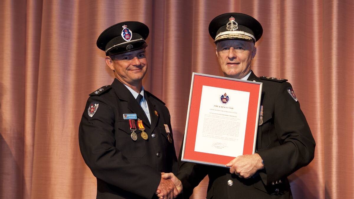 Winner: Station Officer Barren Bofinger with Fire and Rescue NSW Commissioner Greg Mullins. Picture: Fire and Rescue NSW