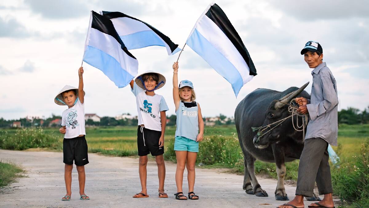 Up Up Cronulla: Finn Petts, Riley Petts and Emily Farrell will support Cronulla all the way from Vietnam. Picture: Wonderlight Photography