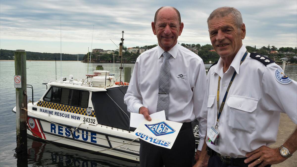 Helping hand: Don Anderson handed over a $10,000 donation to Marine Rescue Botany Port Hacking Commander Frank Robards. Picture: Supplied