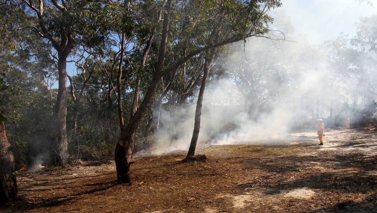 Heat is on: RFS firefighters at a previous hazard reduction burn at Engadine. Picture: Lisa McMahon