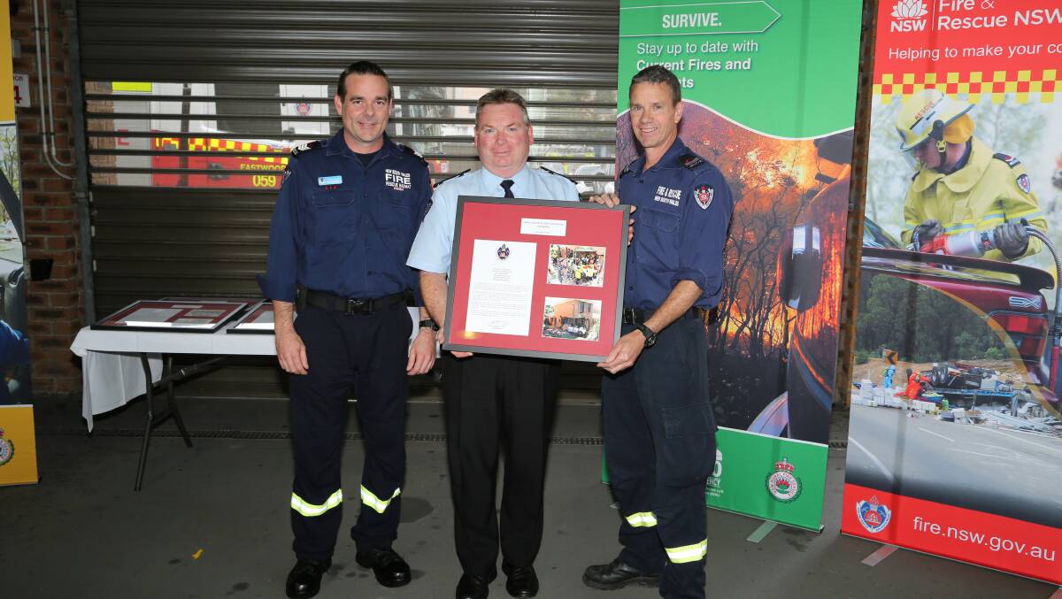 Recognised: Hurstville Senior Firefighter Peter Nolan, FRNSW Acting Commissioner Jim Hamilton and Hurstville Senior Firefighter Alan Rourke. Picture: Fire and Rescue NSW