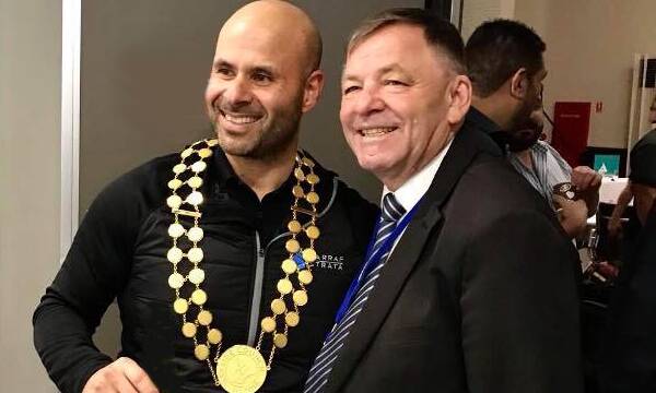 Done deal: Norman Sarrah tries on the mayoral chains alongside Bayside Council Mayor Bill Saravinovski. Picture: Supplied