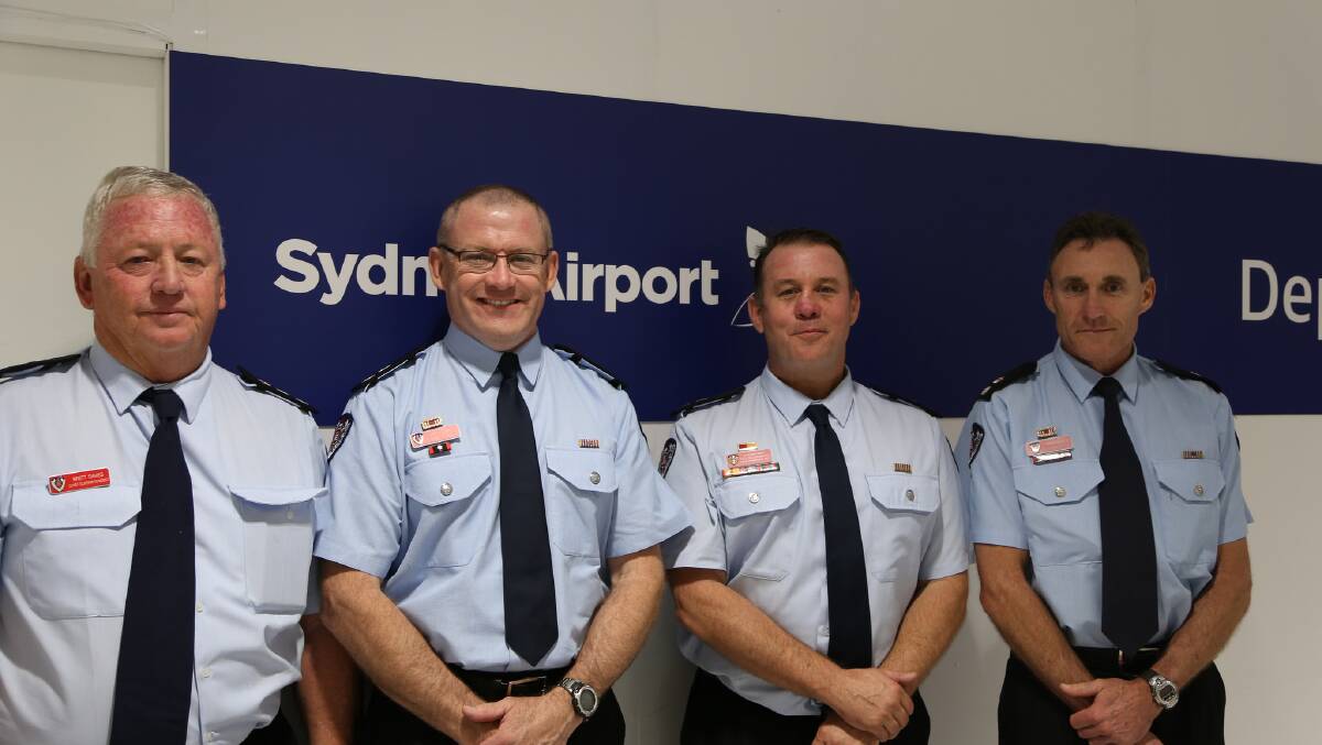 Bon voyage: Chief Superintendent Brett Davies, Superintendent Kel McNamara, Superintendent Jeff Hogan and Superintendent Greg Rankin at Sydney Airport on Wednesday. Picture: FRNSW
