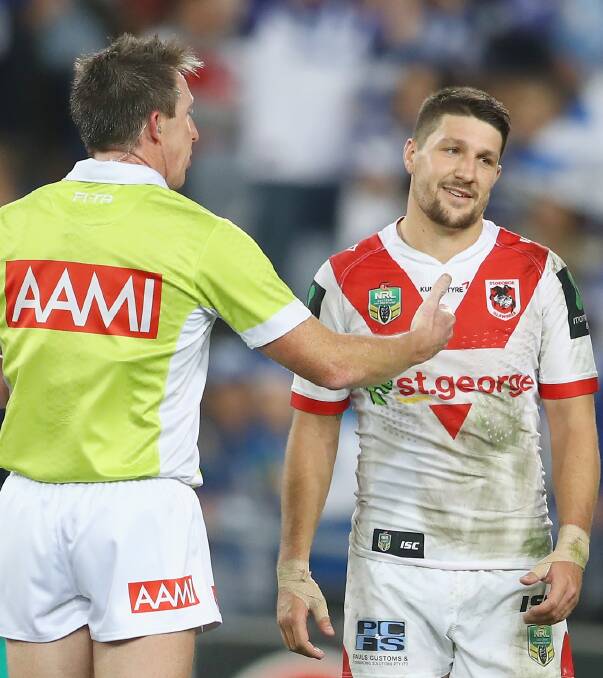 TOUGH TO SWALLOW: Dragons captain Gareth Widdop remonstrates with referee Jared Maxwell after William Hopoate's controversial try on Monday. The Bulldogs went on to win 34-16. Picture: Getty Images