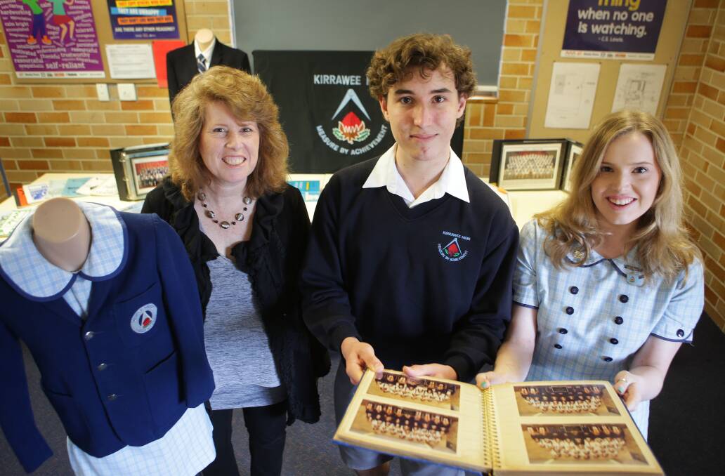 The golden age: Kirrawee High School students, whose parents also attended the school, pictured with a memorabilia display. Picture: John Veage