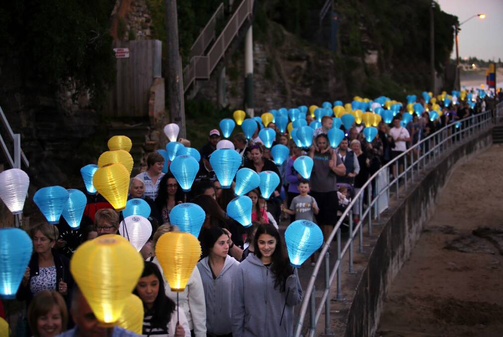Seaside stroll of solidarity: Hundreds of people walk the Esplanade at Cronulla with lanterns in support of The Leukaemia Foundation. Picture: John Veage
