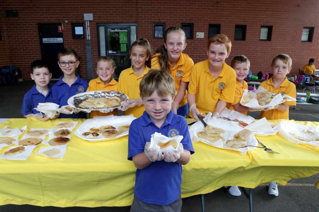 Batter up: Pupils including Bodie Laffan (front) at St Catherine’s Laboure Primary School serve up batches of pancakes on Shrove Tuesday ("Pancake Day") for morning tea. Picture: Jane Dyson