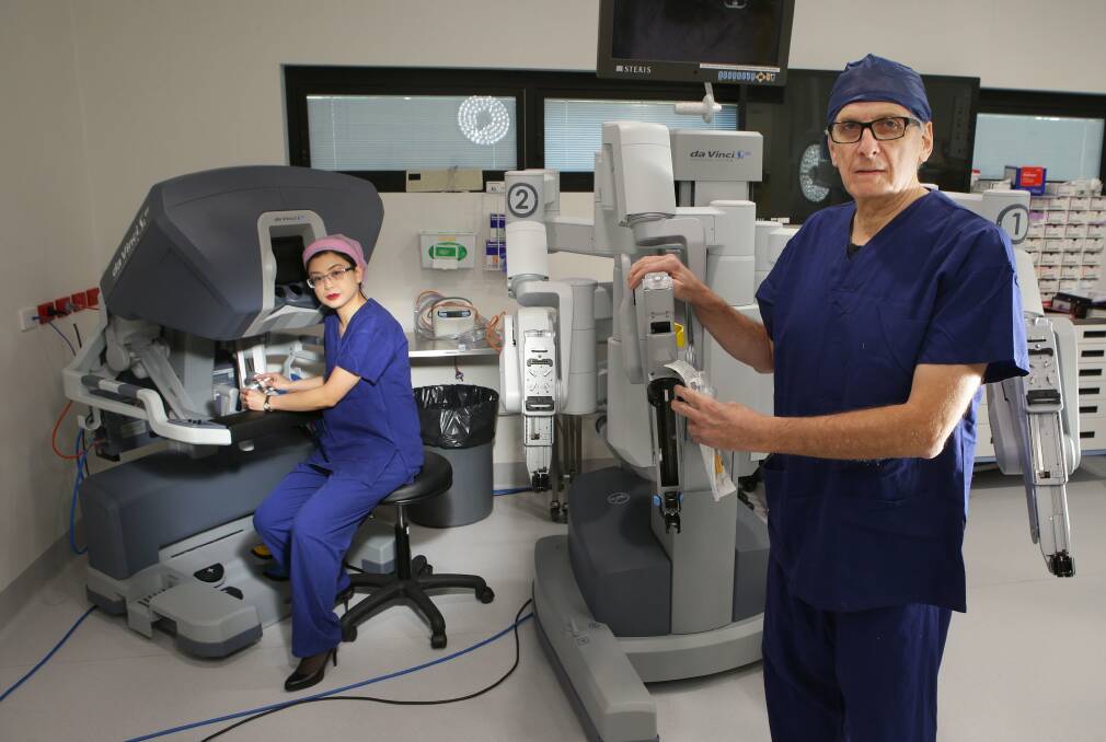 Cancer education: Colorectal surgeon Kim Phan-Thien and St George Hospital's colorectal unit professor of surgery David Lubowski with a new robotics device at Hurstville Private Hospital for Bowel Cancer Awareness Month. Picture: John Veage