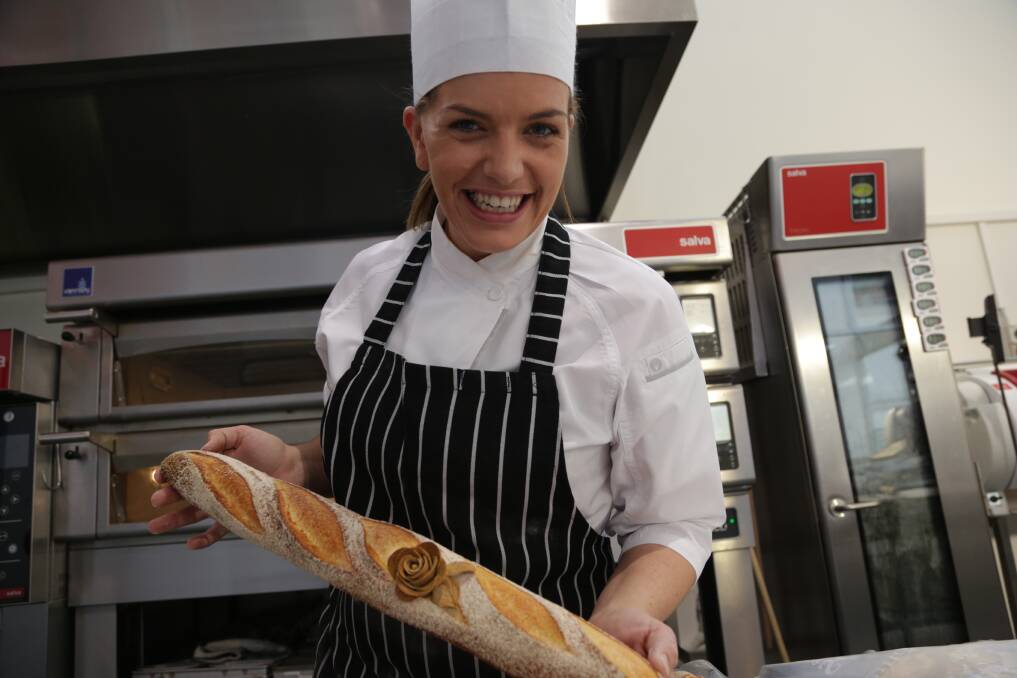 On a roll: Morgan Clementson on duty in Belgium, where she landed a job as a chef.