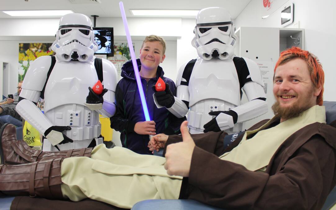Galactic unity: Blood recipient, Tanner Curtis, 14, at the Shire Donor Centre's Star Wars blood drive.