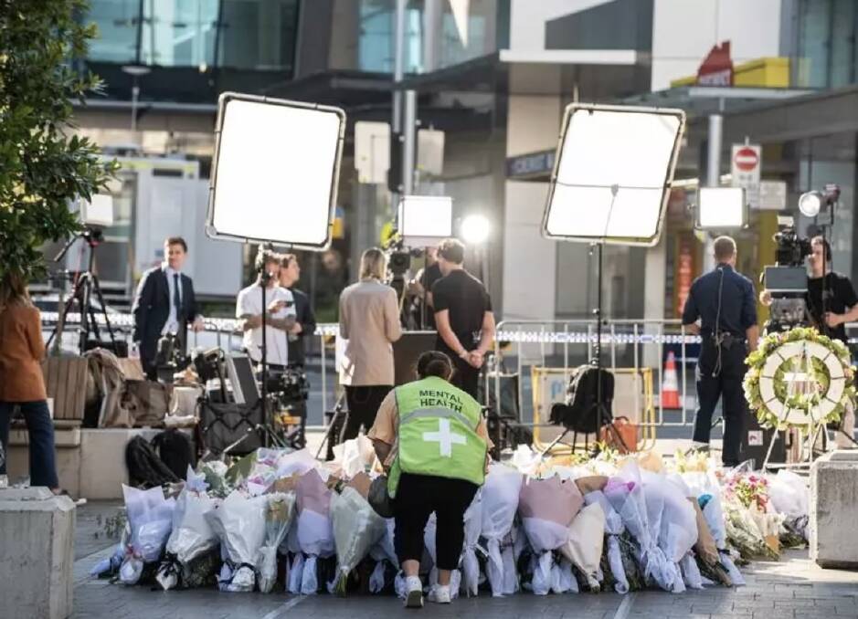 Members of the public laid flowers at a makeshift memorial outside Westfield Bondi Junction. Picture Flavio Brancaleone/AAP PHOTOS