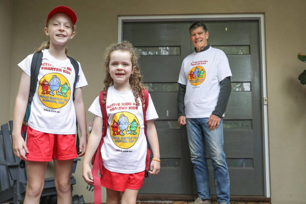 Long-time supporter of National Walk Safely to School Day and Olympian Peter Hadfield with his granddaughters Evie, 9, and Lola, 5, ahead of the event. Picture by John Veage