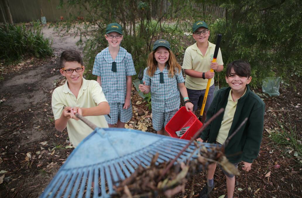 School habitat: The Bright Green Sparks team from Engadine West Public School, including Oliver, Matthew, Amber, Sara and Chayse work on their new garden. Picture: John Veage
