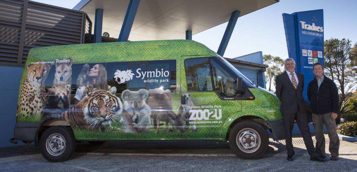 Animal tour: Tradies chief executive officer Tim McAleer and Symbio owner John Radnidge pictured with the van that will be used for the zoo's on-road education programs.