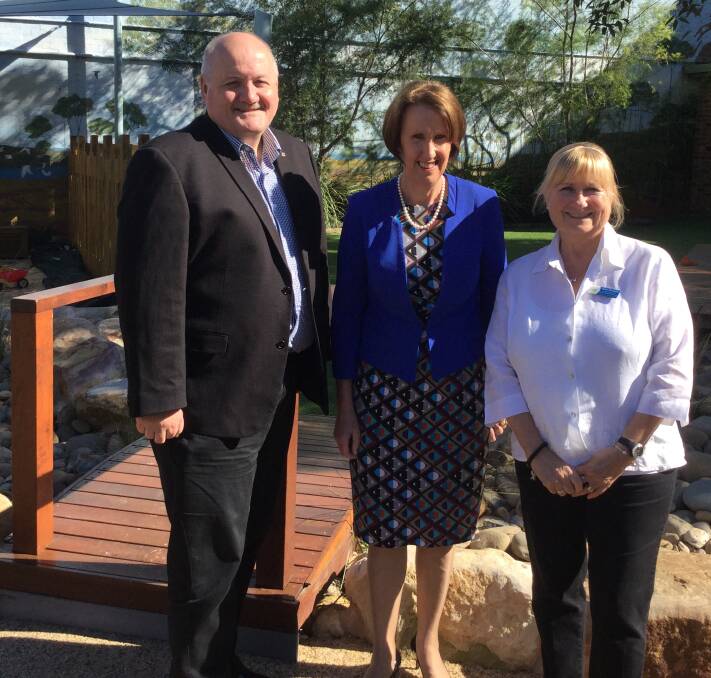 Community visit: Minister for Early Childhood Education, Leslie Williams (middle) meets with staff including teacher Helen Douglas (right) at Engadine Preschool and Heathcote MP Lee Evans (left).