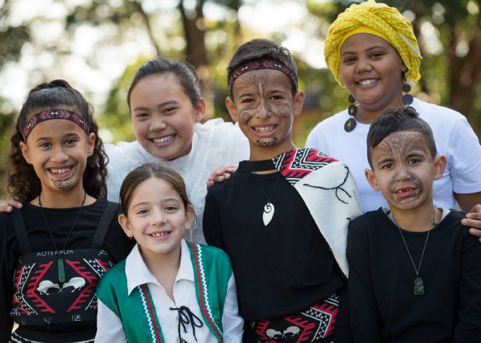 Cultural unity: St Thomas More pupils Nattarene Yupongchay, Anthony McGregor, Sienna Naumovski, Kaleb McGregor, Nia Midikira, and Kiara McGregor wear costumes from their various cultural backgrounds. Picture: Kitty Beale