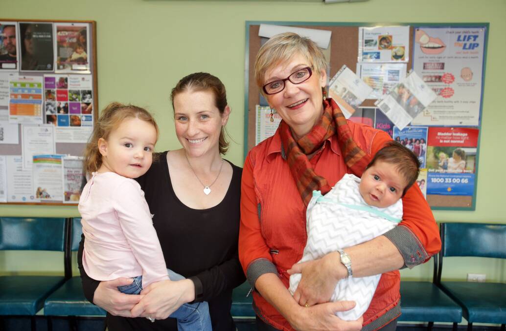 Fond farewell: Nurse Loretta Turnbull (right) with Cassandra, Evelyn and Declan Taseki at Sutherland Shire Family and Health Clinic. Picture: Chris Lane