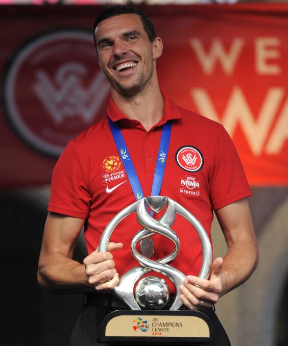 Ante Covic of the Wanderers holds the AFC Championship Trophy in November, 2014. Picture: Brett Hemmings/Getty Images