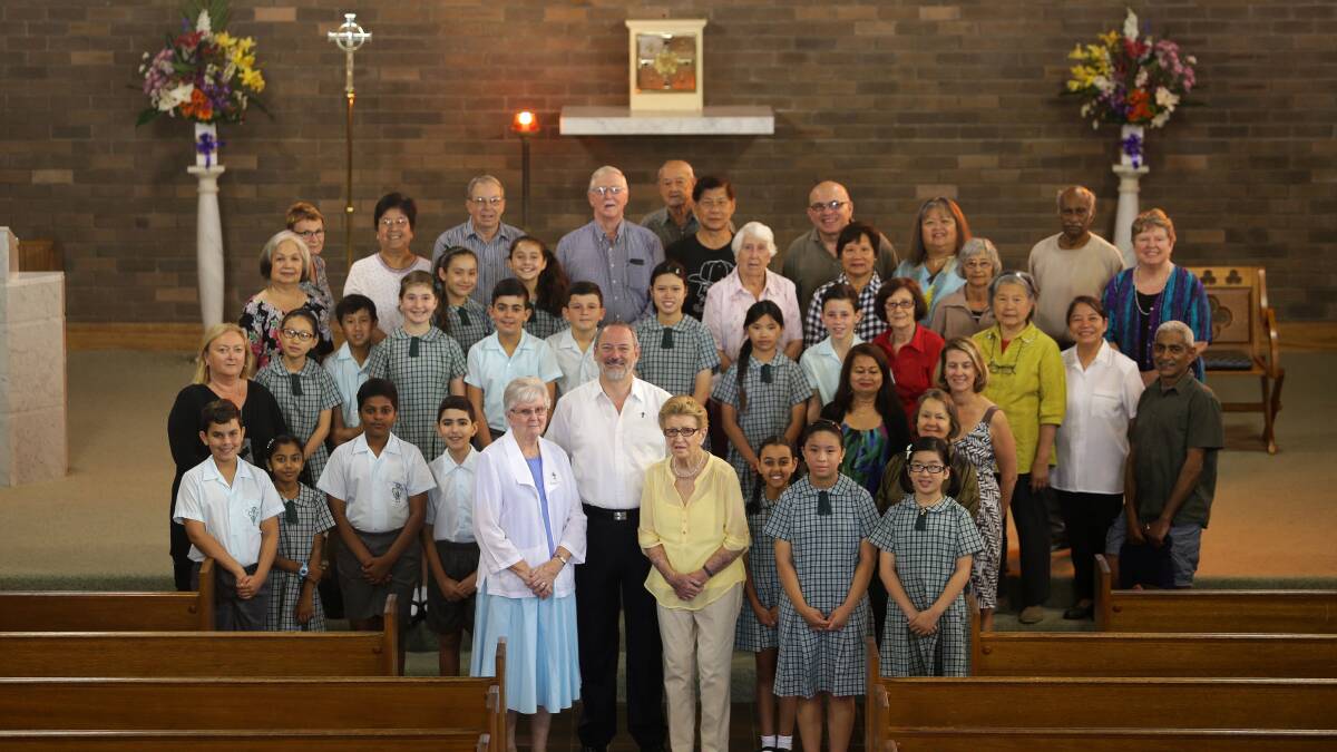 Celebration: Father Brendan Quirk, Sister Marie White and Imelda Leslie (Walz) with parishioners ahead of 125 year celebrations next year. Picture: John Veage