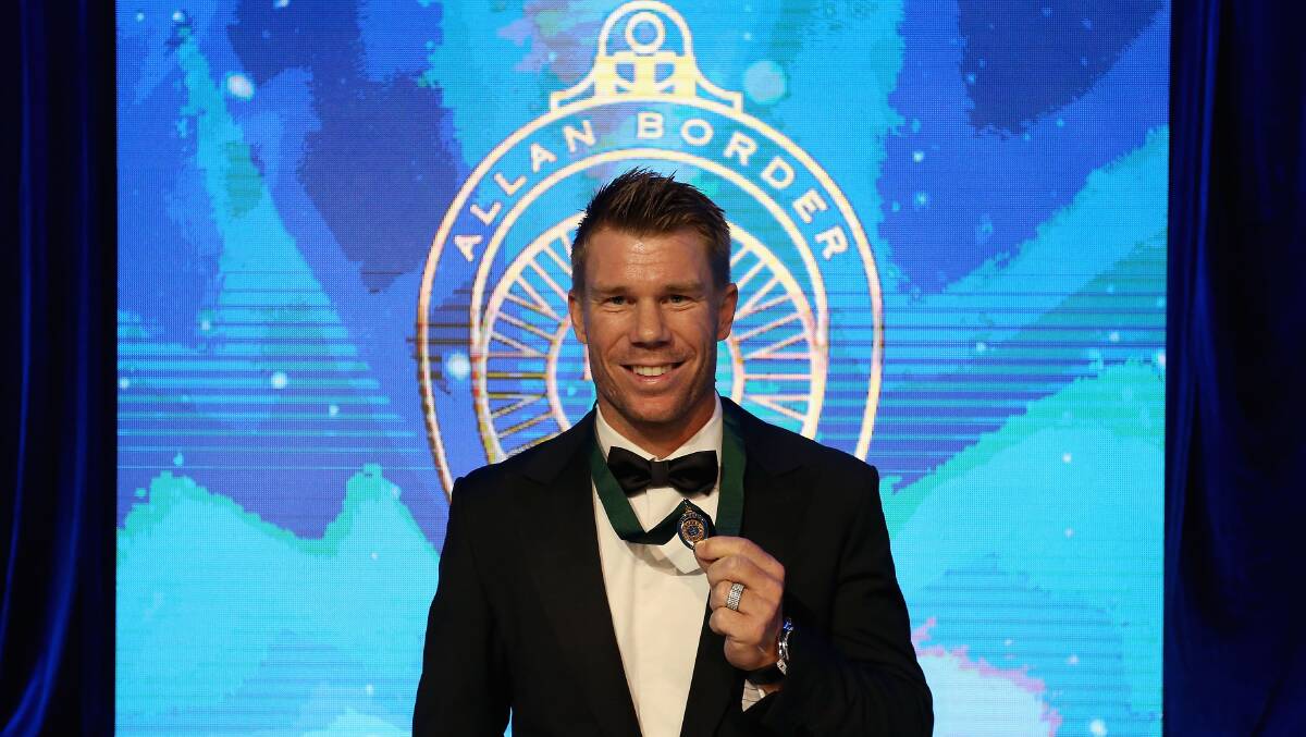 David Warner poses on stage after winning the 2017 Allan Border Medal at The Star on Monday night. Picture: Jason McCawley/Getty Images