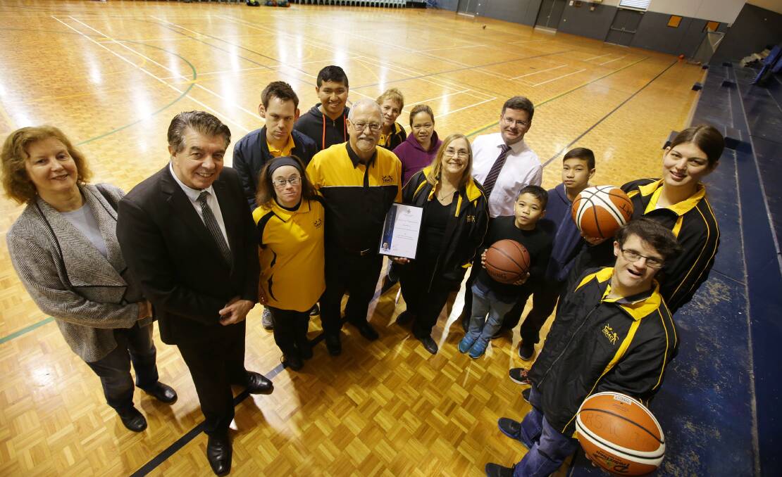 Community connection: NSW Minister for Disabilities Ray Williams (second from left) and Oatley MP Mark Coure (back) presented a grant to support the activities of Hurstville special athletes including Hannah Sandeman-NSW Special Olympics basketballer (right). Picture: John Veage