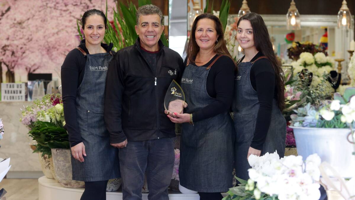 Winners: B&M Florist owners Maria and Bill Rizos with daughters Katrina Bakis and Joanne Poulos celebrate after taking out the Florist of the Year award in the Sydney Market's Fresh Awards. Picture: Chris Lane