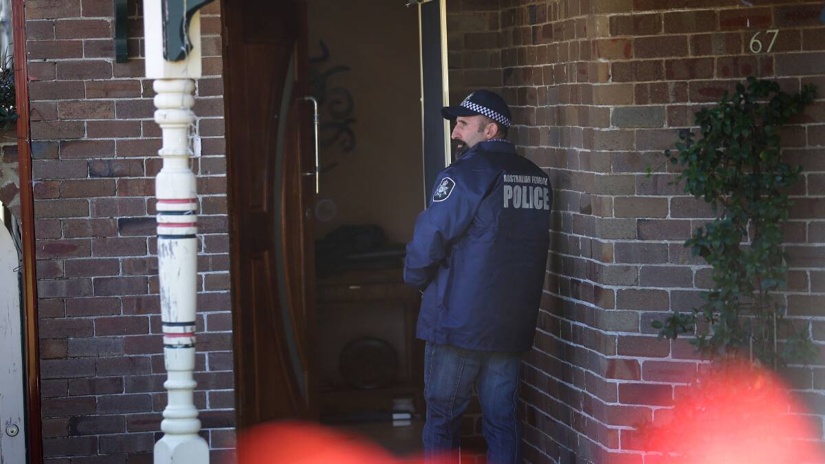 Investigation: Australian Federal Police raid a house on Wollongong Road at Arncliffe on Tuesday. Picture: John Veage