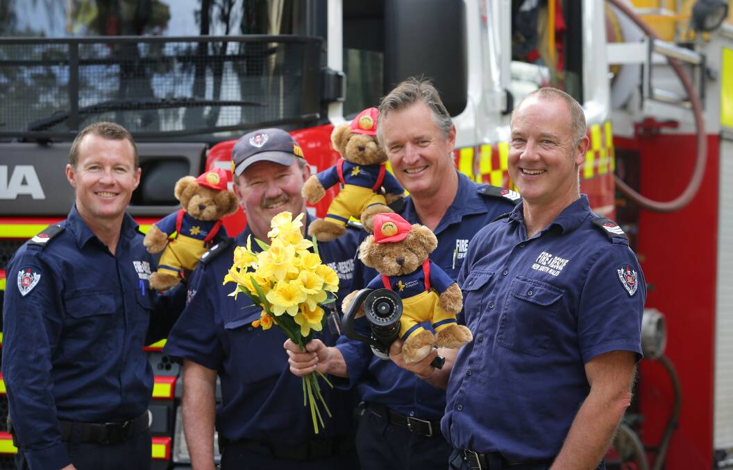 Giving back: Miranda firefighters Clayton Stevenson, Peter Morris, Station Officer Ross Meldrum and Brett Hogan show their support for Daffodil Day. Picture: John Veage