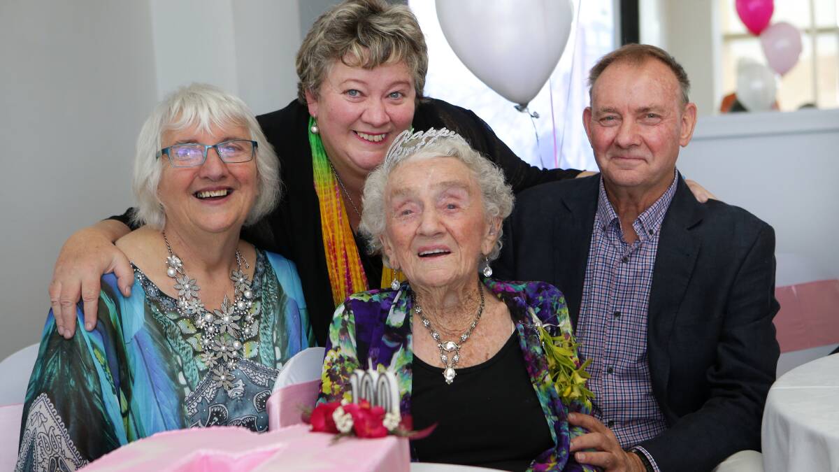 Still adventurous: Marjory Kember celebrates turning 100 with her children (left to right) Karen Law, Barbara Major and Geoffrey Kember. Picture: John Veage