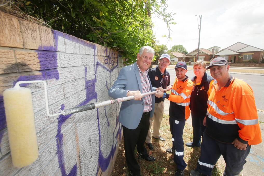 Graffiti Squad: from left, Georges River mayor Kevin Greene with Hursvtille Scouts' John Dwyer, council's Simon Hughes, Hurstville Rotary's Jan Gartrell and council's Brad Lawton at a graffiti hot spot. Picture: Chris Lane