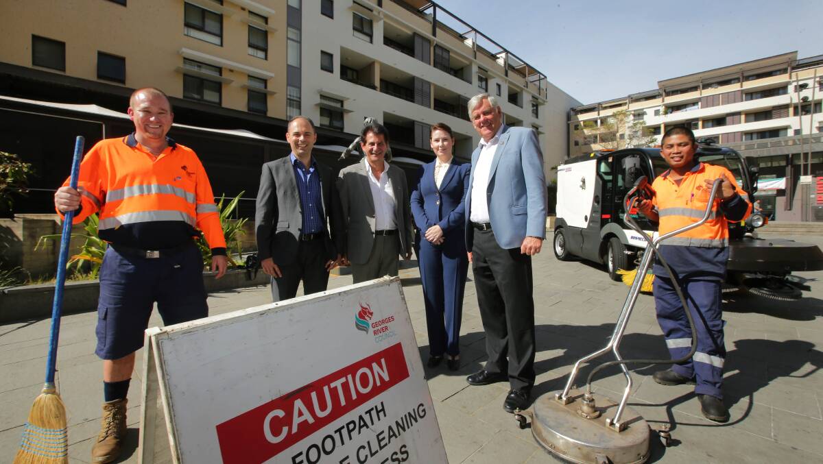 Scrubbing up: from left, Councillors Stephen Agius, Nick Katris and Leesha Payor with Mayor Kevin Greene and council cleaners Anthony and Freddy get ready for operation Kogarah Clean. Picture: John Veage