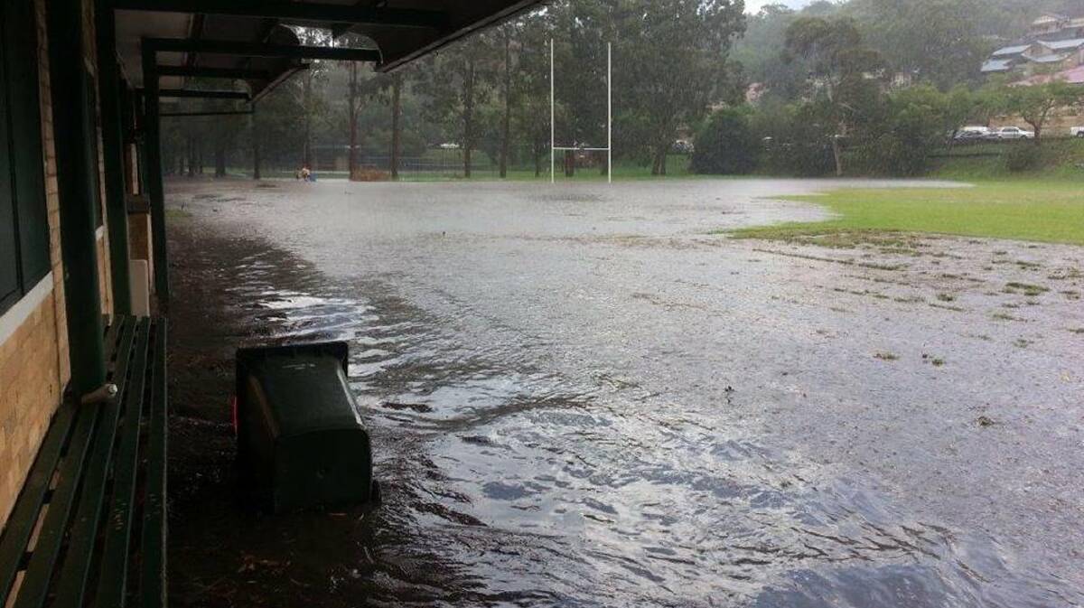 Low-lying site: Flooding of the clubhouse and oval in April last year. Picture: supplied