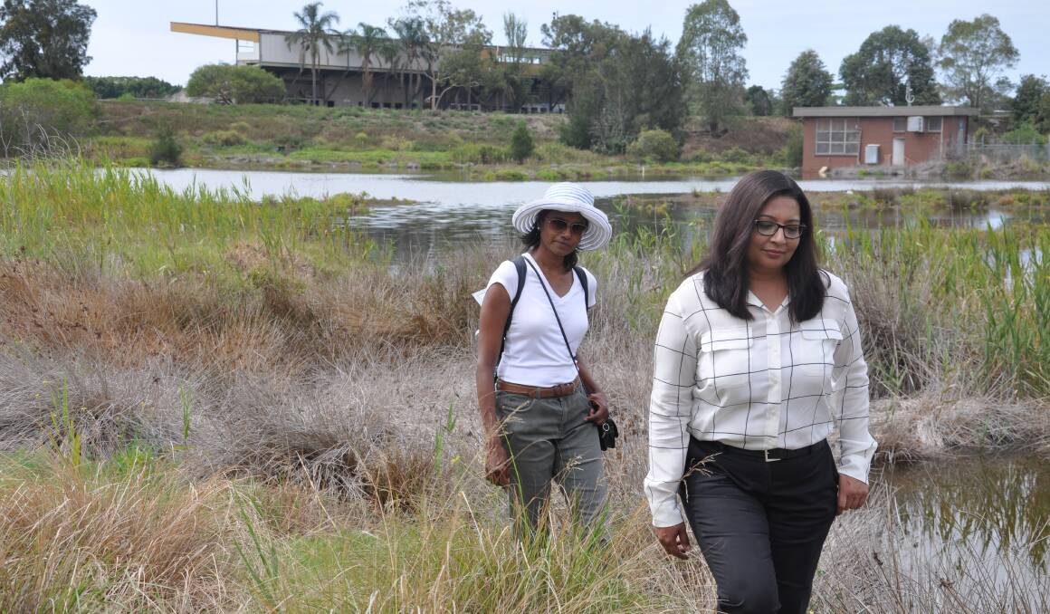 Call to action: Mehreen Faruqi (front) and Sumi Skellam at Landing Lights Wetland, with St George Stadium in the background.