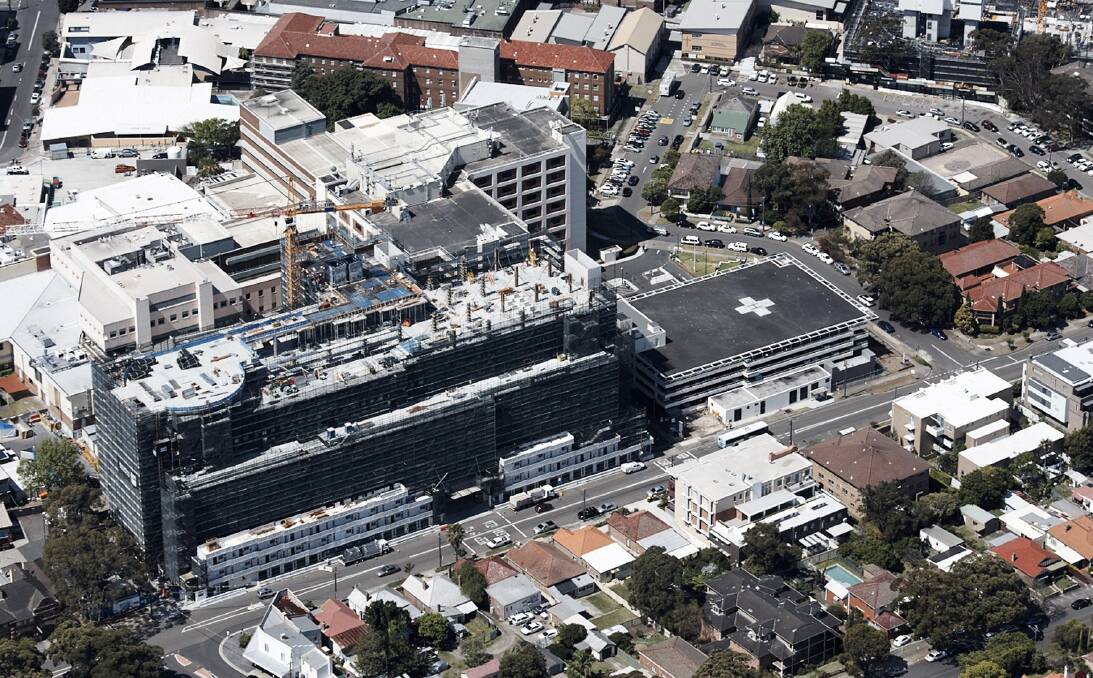 More to do:  This 2016 image shows the nine-storey acute services block under construction in  the foreground and old brick buildings dating back to 1937 at the rear. Picture: supplied