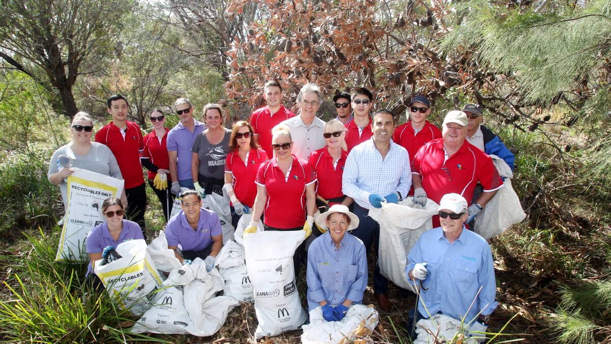 Club Central staff (in red shirts) and other volunteers who took part in the clean-up of Menai Conservation Reserve. Picture: Chris Lane