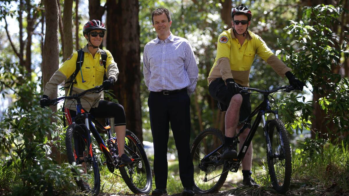 Mark Speakman with rangers Anita Zubovic and David Croft on the new mountain bikes. Picture: John Veage

