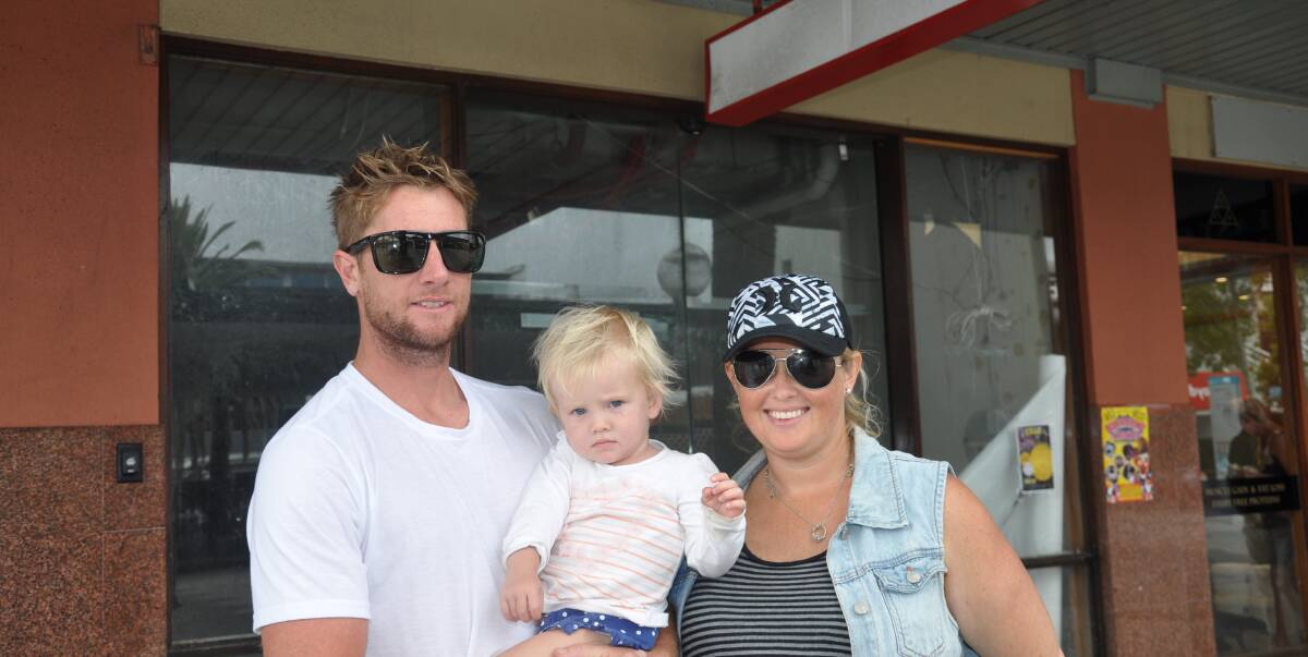 Good news: Sarah and Daniel Hayllar, with Jerico, 18 months, outside the old "Maccas" in Cronulla mall, where construction work is occurring before the opening of a dumplings restaurant..