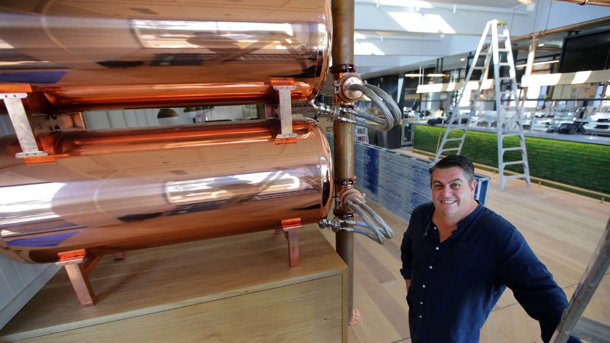 Success hailed: Feros Hotel Group chief executive Chris Feros shows off the beer tanks before the opening on February 6. Picture: John Veage