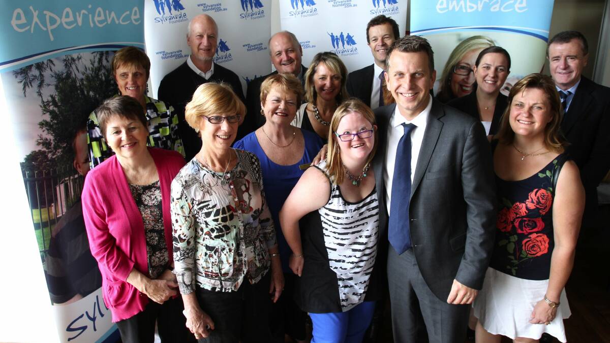 Breakthrough in 2011: Then NSW Disability Minister Andrew Constance chooses the group to trial individual supported accommodation packages. Picture: John Veage