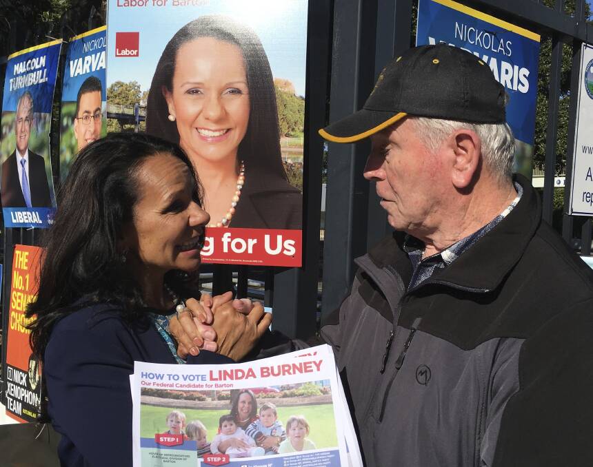 Linda Burney with a supporter at the Rockdale Public School polling booth. Picture: Juno Gemes