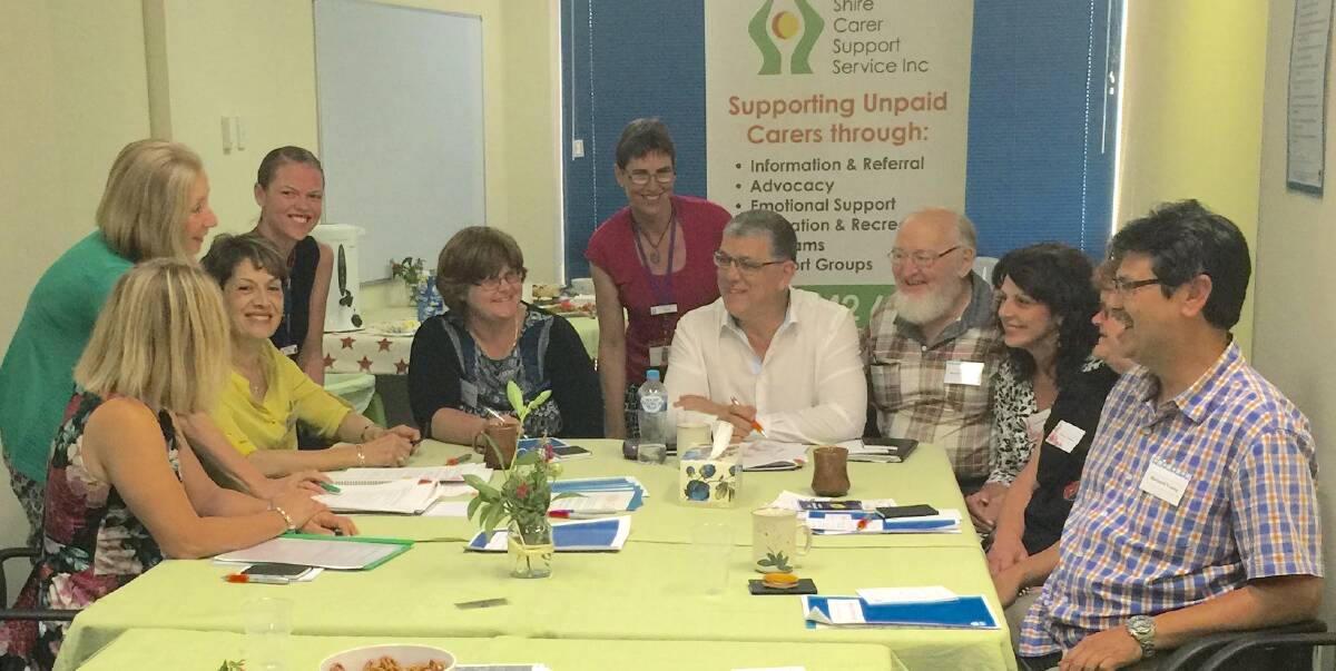 Legilslation review: Carers discuss with John Ajaka (in white shirt) how the NSW Carer Recognition Act can be improved during a meeting at Stapleton Avenue Community Centre. Picture: supplied