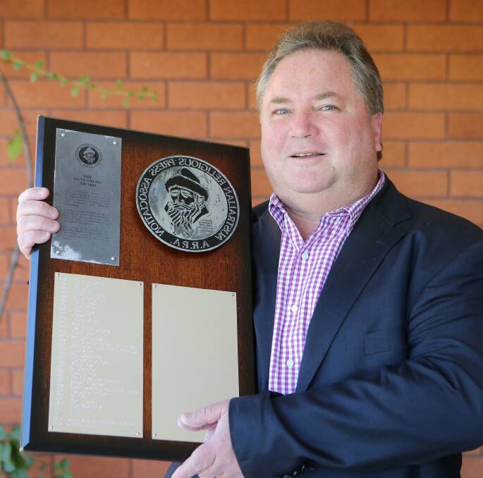 Recognition: Graeme Cole with the Gutenberg Award, which was presented by the Australasian Religious Press Association. Picture: John Veage