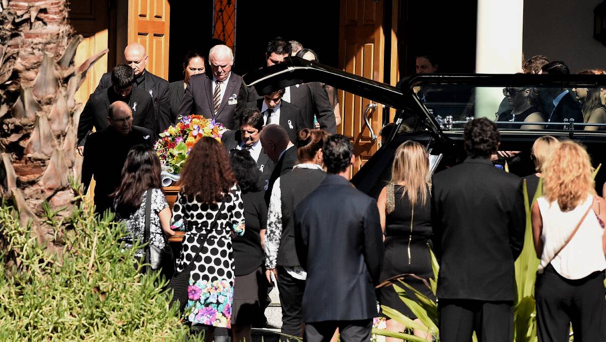 Farewelled: The coffin of Tina Kontozis is carried fromSt Styliano's Greek Orthodox Church in Gymea. Picture: Kate Geraghty
