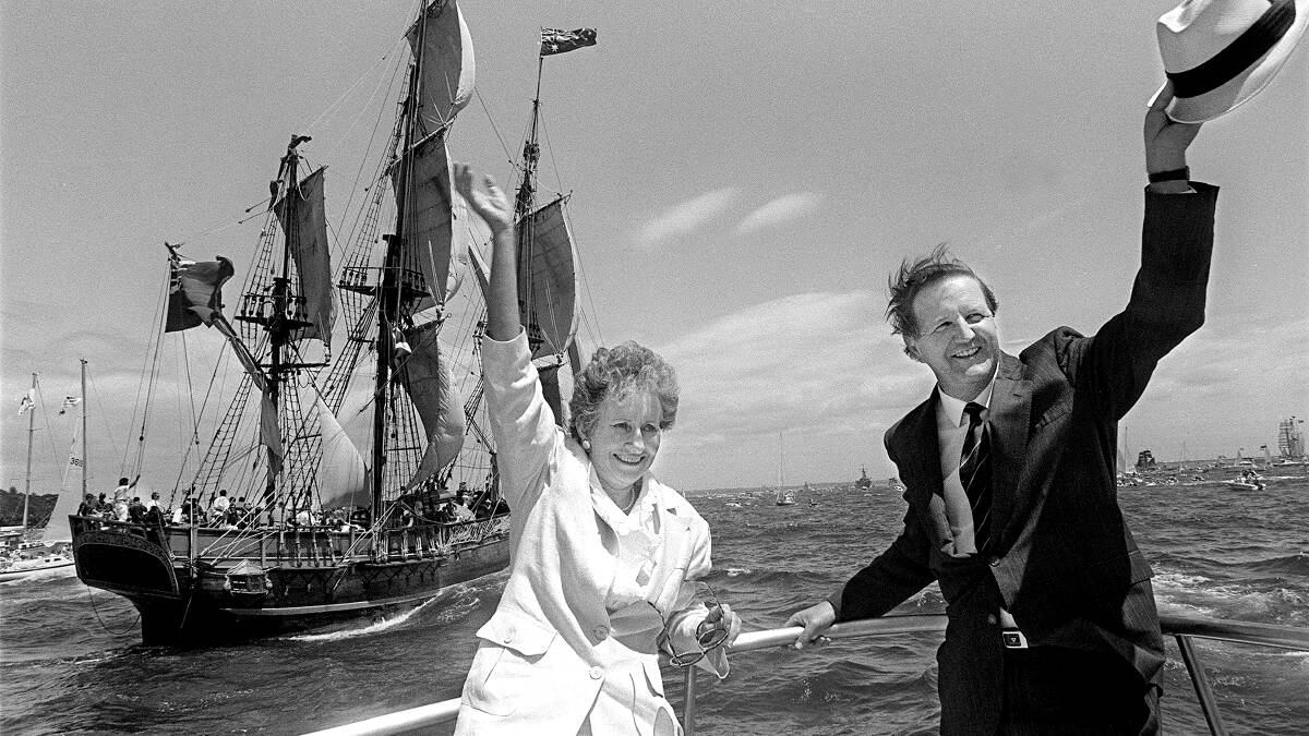 A replica of Captain Bligh’s infamous ship The Bounty is in the background as Barrie and Pauline Unsworth welcome the fleet. Picture: John Veage